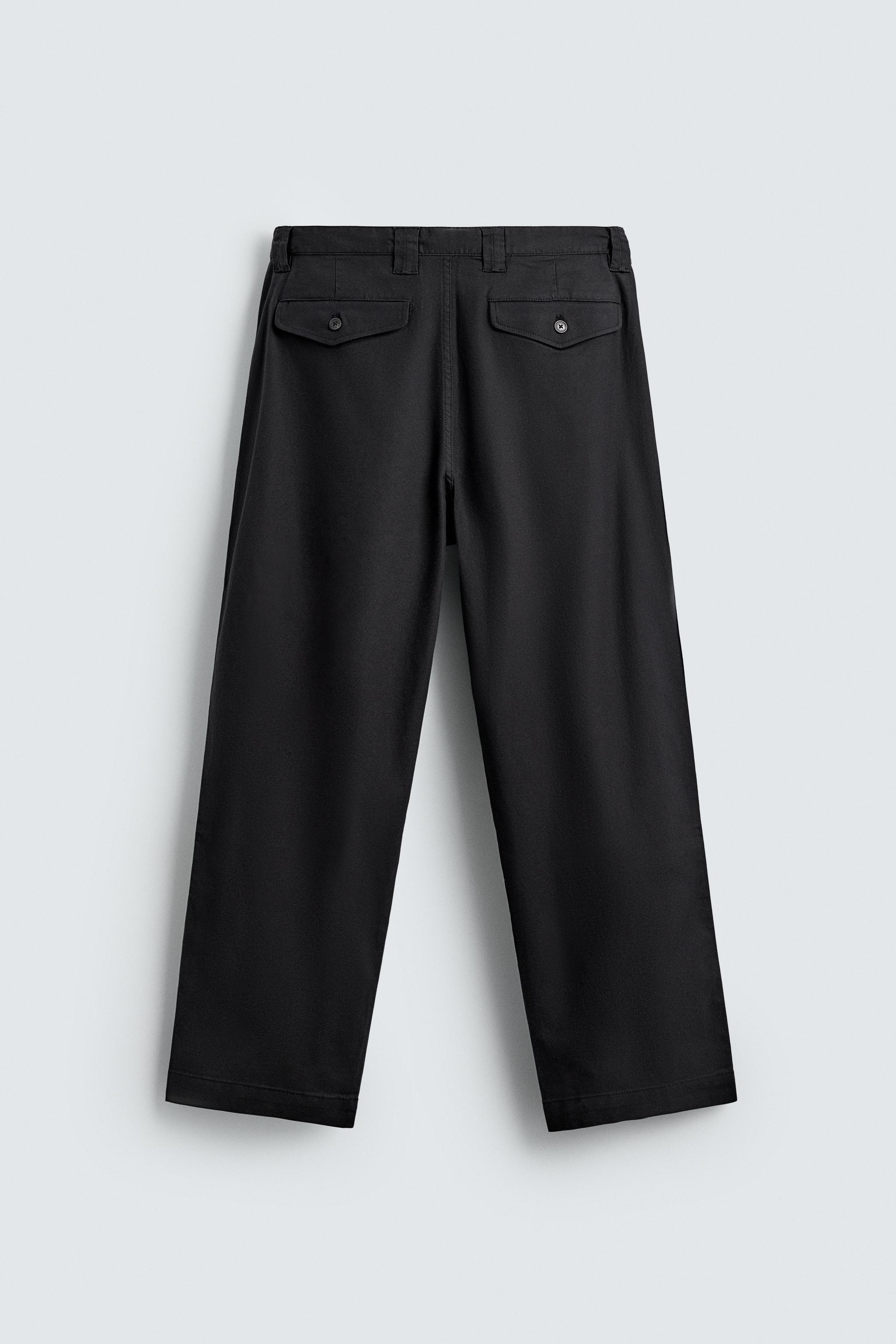 RELAXED FIT PLEATED PANTS